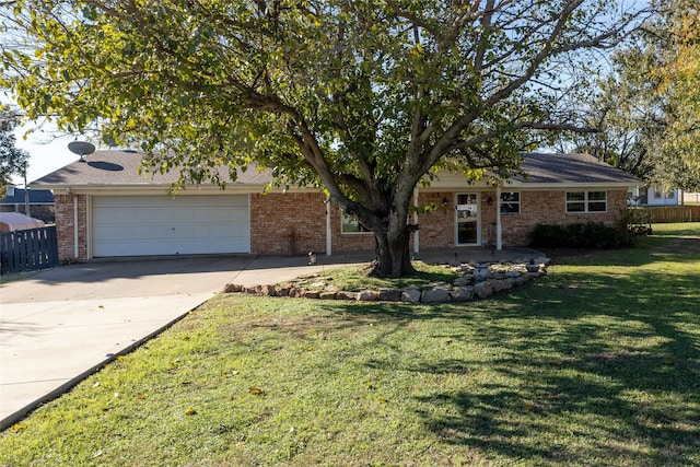 ranch-style home with a front lawn and a garage