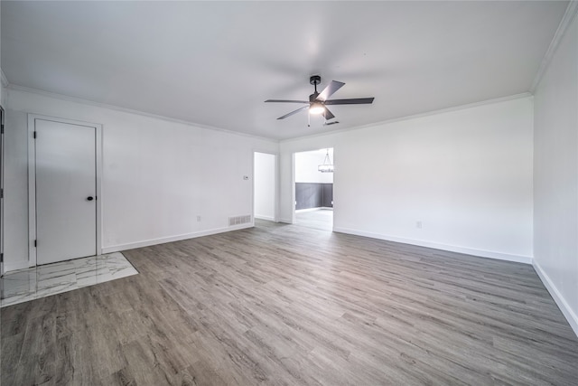 unfurnished room featuring dark wood-type flooring, ceiling fan, and ornamental molding