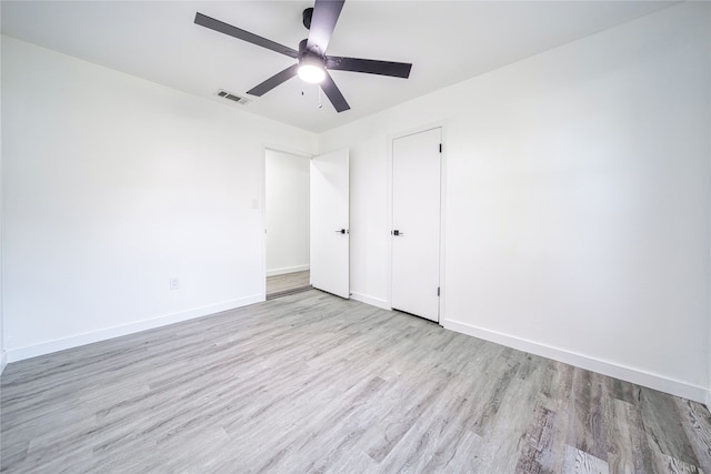 unfurnished bedroom with ceiling fan and light hardwood / wood-style flooring