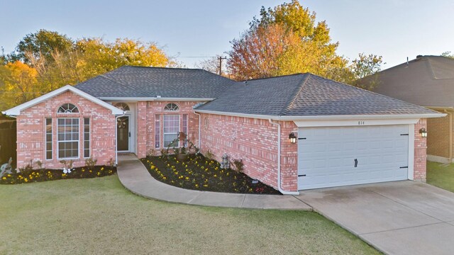 single story home with a yard and a garage