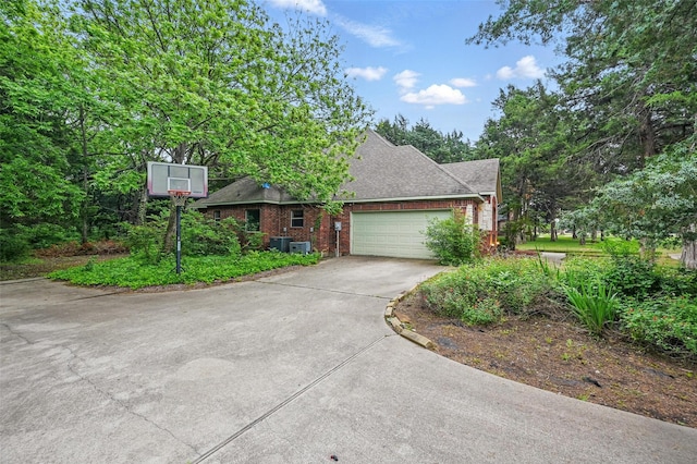 3421 Mindy Ln, Midlothian, TX 76065 - view of front facade with driveway, a garage, brick siding, and roof with shingles
