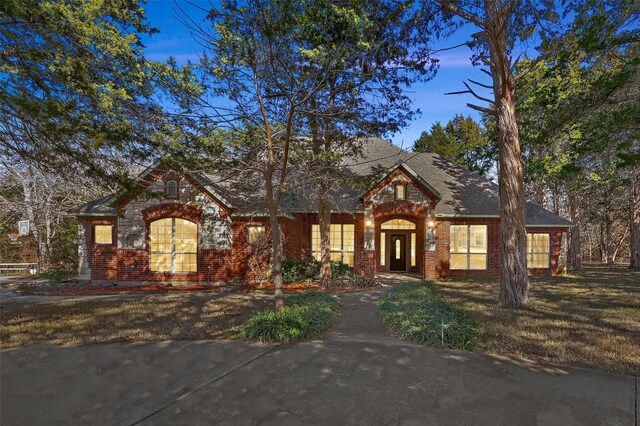 3421 Mindy Ln, Midlothian, TX 76065 - view of front of home featuring brick siding, a chimney, and roof with shingles