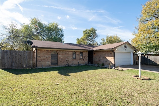 ranch-style home featuring a front yard and a garage