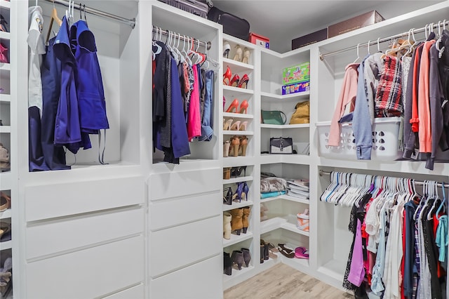 spacious closet featuring light hardwood / wood-style floors