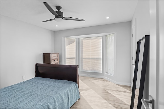 bedroom with light wood-type flooring and ceiling fan