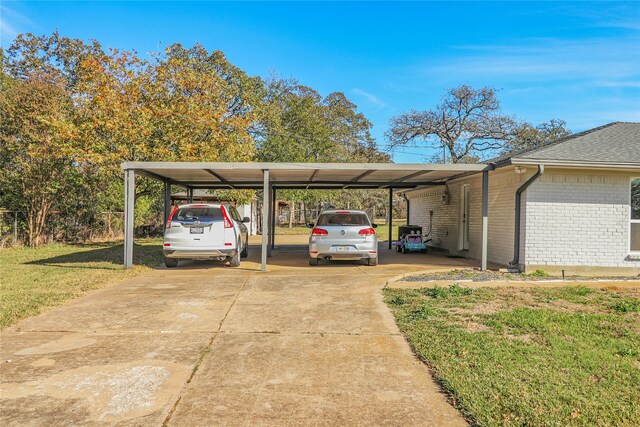 view of car parking featuring a carport and driveway