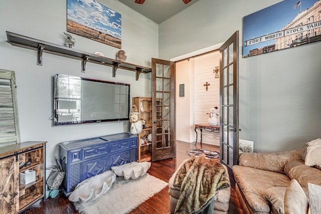 living room featuring ceiling fan, french doors, and dark hardwood / wood-style floors