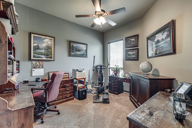 carpeted home office with ceiling fan