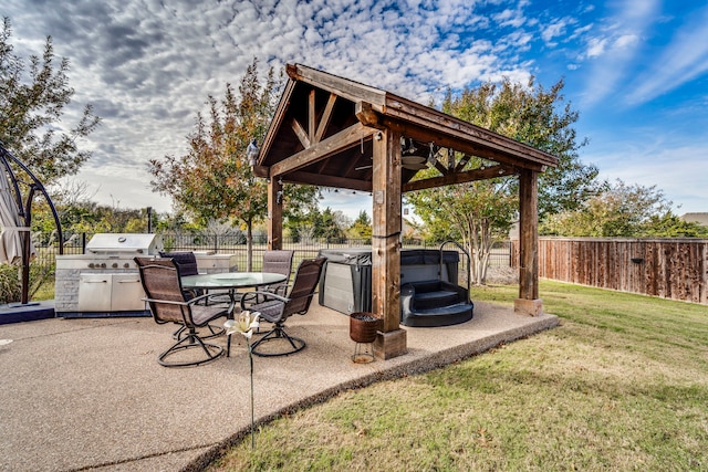 view of patio with a gazebo, area for grilling, and a hot tub