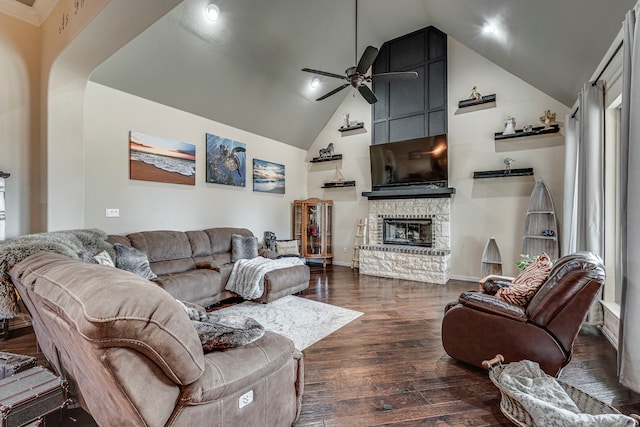 living room featuring a fireplace, dark hardwood / wood-style floors, high vaulted ceiling, and ceiling fan