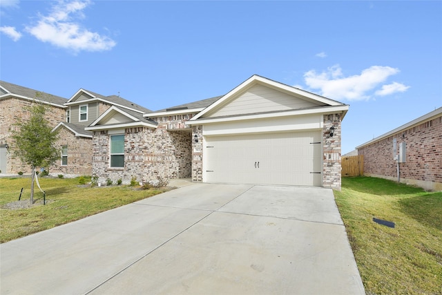 view of front facade with a front yard and a garage