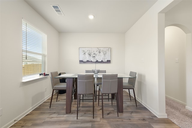 dining room with hardwood / wood-style floors