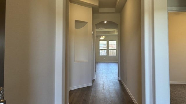 hallway with dark wood-type flooring