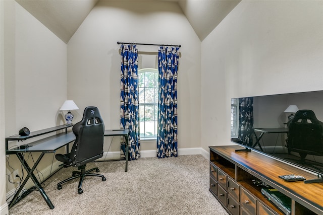 carpeted office with vaulted ceiling