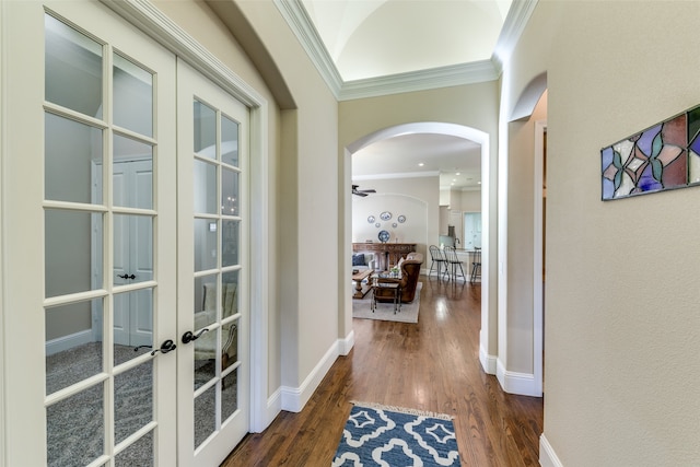 hall with dark hardwood / wood-style flooring, french doors, and ornamental molding