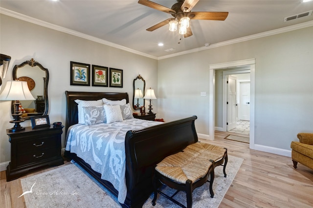 bedroom featuring crown molding, ceiling fan, and light hardwood / wood-style flooring