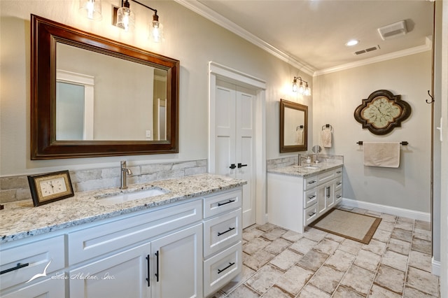 bathroom with vanity and ornamental molding