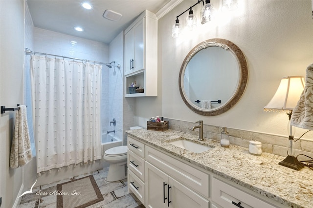 full bathroom with vanity, toilet, and shower / bath combo