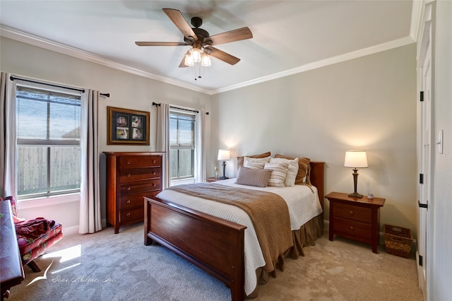 bedroom featuring multiple windows, ceiling fan, light carpet, and ornamental molding