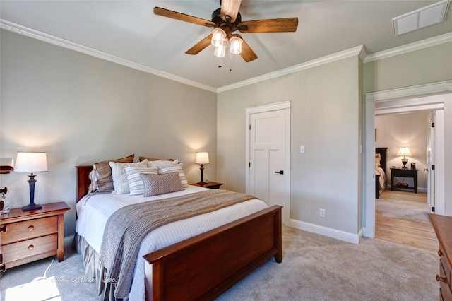 bedroom with light colored carpet, ceiling fan, and ornamental molding