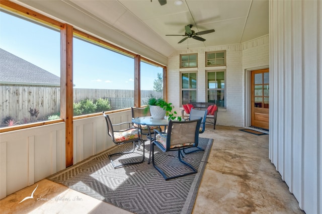 sunroom / solarium featuring ceiling fan