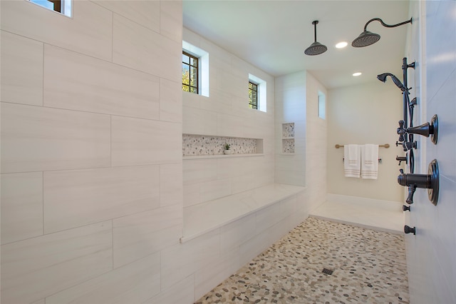 bathroom with tiled shower