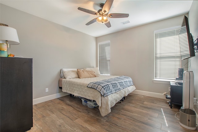 bedroom featuring hardwood / wood-style flooring and ceiling fan