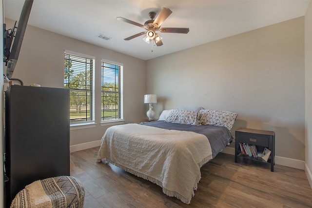 bedroom featuring hardwood / wood-style floors and ceiling fan