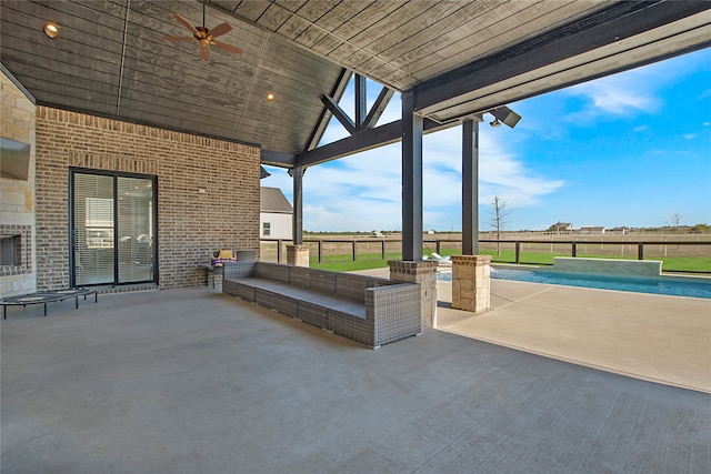 view of patio featuring pool water feature, ceiling fan, and a fenced in pool