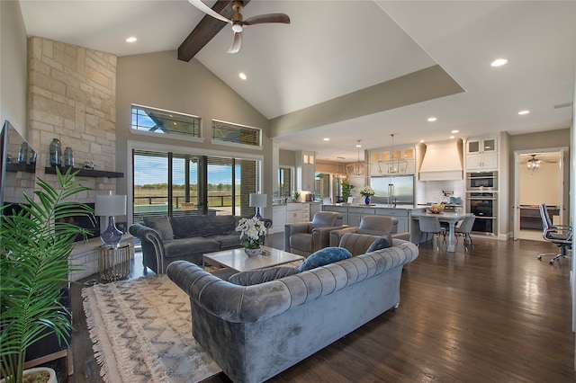 living room with ceiling fan, beamed ceiling, dark hardwood / wood-style floors, and high vaulted ceiling