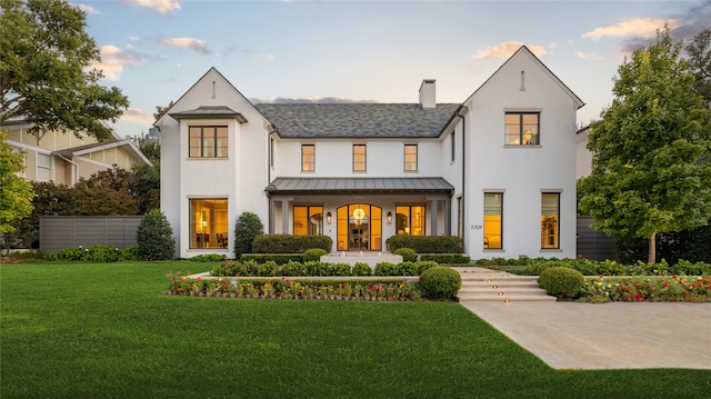 view of front of property with a lawn