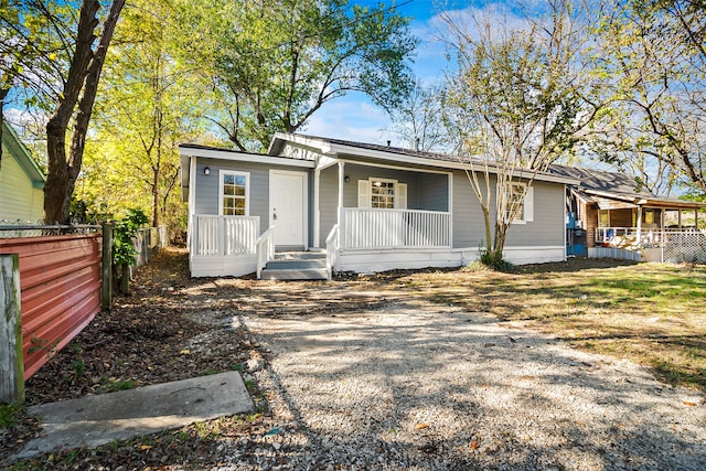 back of property featuring a porch