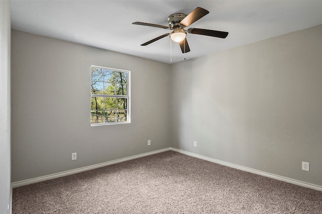 empty room featuring carpet floors and ceiling fan