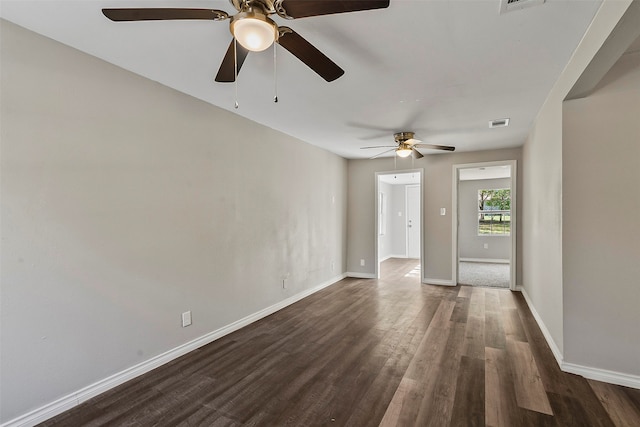 unfurnished room with dark hardwood / wood-style floors and ceiling fan