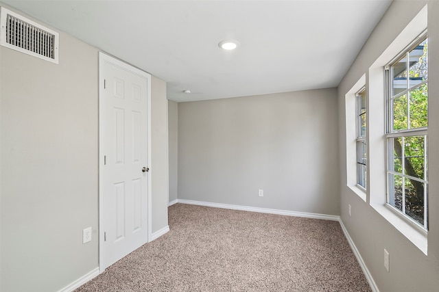 spare room with carpet floors