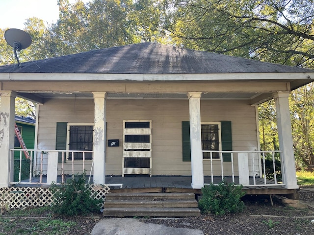 doorway to property featuring covered porch