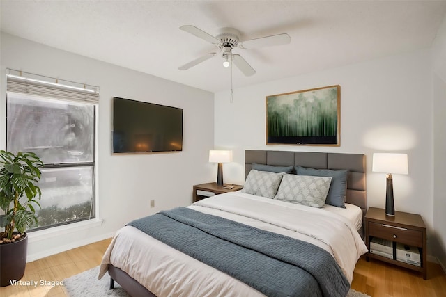 bedroom featuring ceiling fan and light wood-type flooring