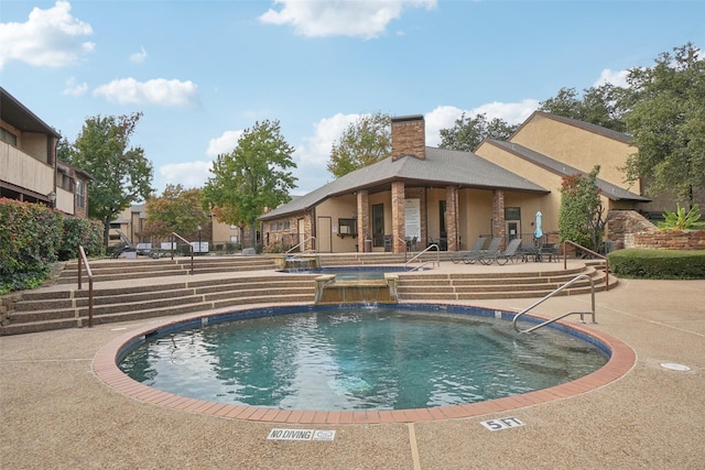 pool featuring a patio area