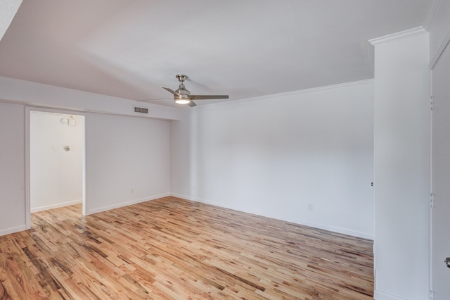 empty room featuring ceiling fan, ornamental molding, and light wood-type flooring