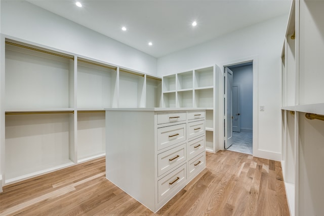 spacious closet with light hardwood / wood-style flooring