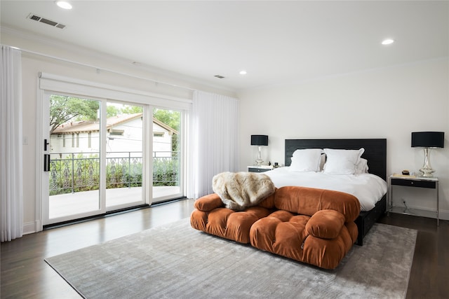 bedroom with access to outside, dark hardwood / wood-style flooring, and ornamental molding