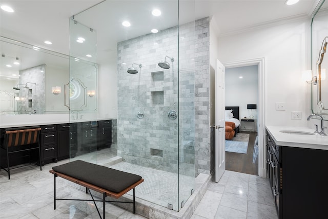 bathroom featuring a tile shower, vanity, hardwood / wood-style flooring, and ornamental molding