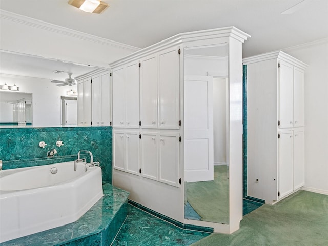 bathroom with ornamental molding, a washtub, and ceiling fan