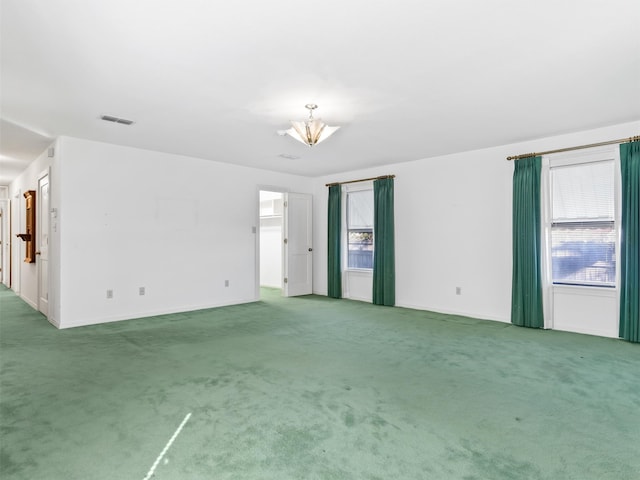 unfurnished room with carpet floors