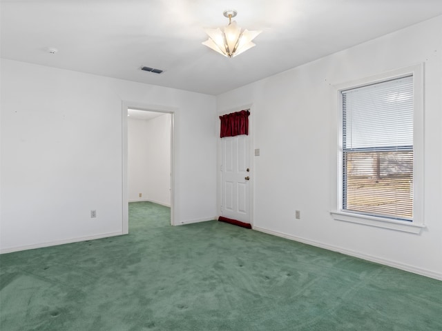 unfurnished room featuring carpet floors