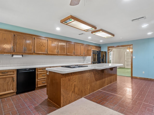 kitchen with fridge with ice dispenser, a center island, dishwasher, stainless steel gas stovetop, and decorative backsplash