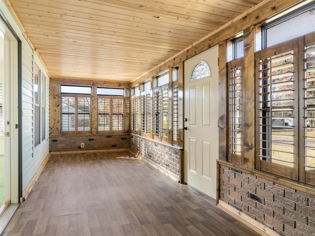 unfurnished sunroom featuring wood ceiling