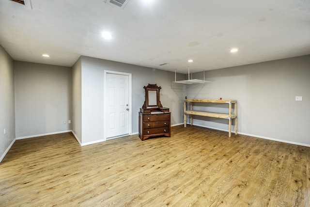 basement featuring light hardwood / wood-style flooring