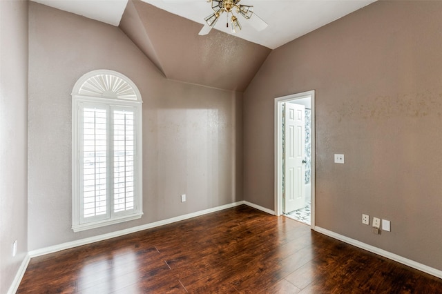 entrance foyer featuring lofted ceiling, dark hardwood / wood-style floors, and ceiling fan