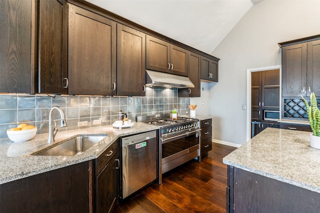 kitchen featuring sink, stainless steel appliances, light stone countertops, dark hardwood / wood-style flooring, and vaulted ceiling